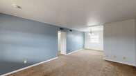 This single-story residence in Evansville, IN offers 760 square feet of living space, efficiently divided into three bedrooms, one bathroom, and two kitchen areas. The home's interior is characterized by a neutral color palette, with light gray walls throughout most rooms, creating a bright and airy atmosphere. Large windows in each bedroom allow for ample natural light, enhancing the sense of spaciousness. The flooring varies, with plush carpeting in the bedrooms and living areas, while the kitchen and bathroom feature practical hardwood floors. The primary bedroom is notably spacious at 310 square feet, offering plenty of room for personalization. The kitchen, though compact, is functional with white cabinetry, a double sink, and essential appliances. The bathroom showcases a clean, white design with a shower/tub combination. Built-in storage solutions, such as closets with sliding doors and kitchen pantry shelving, maximize the use of space in this cozy home. The overall design emphasizes simplicity and functionality, making it an ideal canvas for a variety of decorating styles.