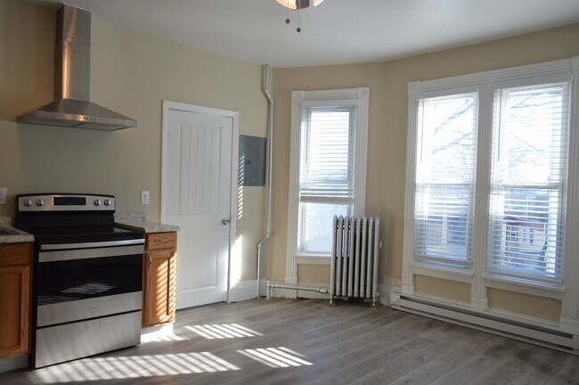 Steam heated living area with additional electric baseboard Luxury plank flooring throughout - 15 Huntington St