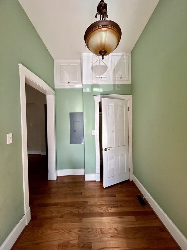 Foyer with storage, living area entrance to left - 401 Dinwiddie St