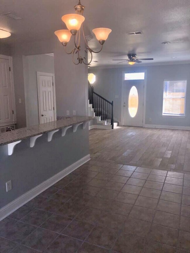 Brand new wood look tile downstairs. - 1340 Tropical Cove