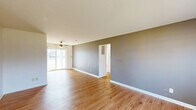 This charming single-story residence in Evansville, IN offers 740 square feet of thoughtfully designed living space. The home features two bedrooms, including a primary bedroom of 170 square feet, and one full bathroom. The interior showcases gleaming hardwood floors throughout, creating a cohesive and warm atmosphere.

The kitchen is a standout feature, boasting a practical U-shaped design with ample cabinet space. White cabinetry with contrasting hardware adds a touch of classic charm, while the window above the sink allows natural light to flood the space. Appliances include a refrigerator and range, making it ready for immediate use.

Both bedrooms are generously sized, with large windows that provide plenty of natural light and views of the surrounding area. The bathroom is efficiently designed with a combined tub and shower, complemented by a single vanity.

The home's neutral color palette and abundance of windows create a bright, airy feel throughout. A hallway connects the various rooms, enhancing the flow of the space. The property's compact size and thoughtful layout make it an ideal choice for those seeking a low-maintenance yet comfortable living environment.