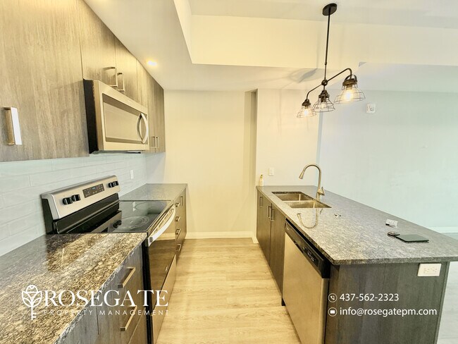 Photo du bâtiment - Modern 1-Bedroom Condo with Balcony in Dow...