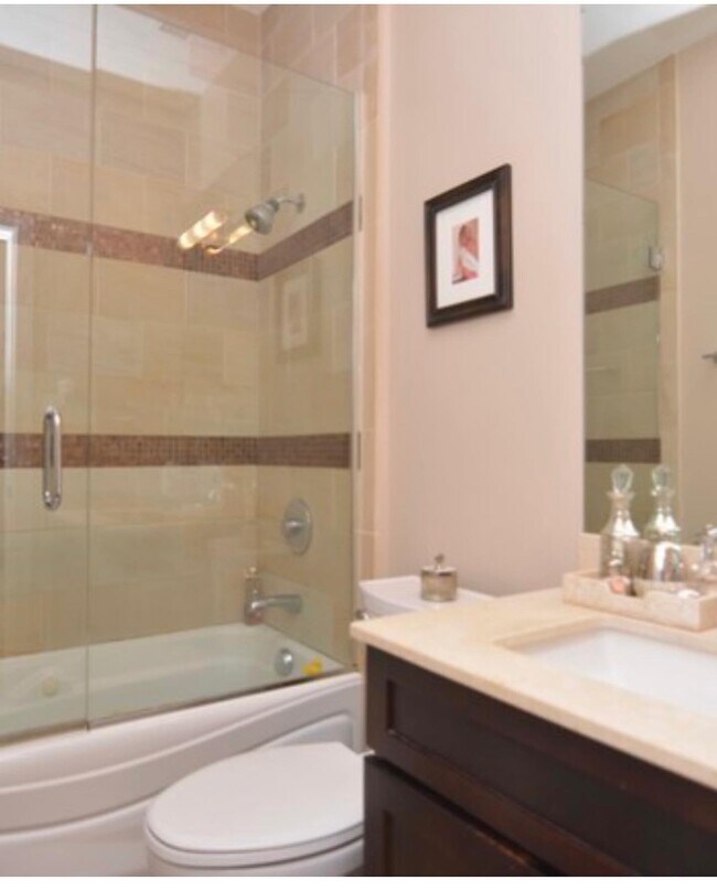 Full bathroom with tub and shower - 1913 W Erie St