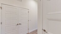 Located at 201 S Weber St in the heart of Colorado Springs, CO, this well-appointed 2-bedroom, 2-bathroom residence offers a thoughtfully designed single-level layout. The open-concept kitchen and living area serves as the centerpiece of the home, featuring soaring ceilings, light wood-style flooring, and a large kitchen island with granite countertops and an undermount sink. Sleek white cabinetry, a white subway tile backsplash, stainless steel appliances, and a trio of industrial-style pendant lights complete the modern kitchen aesthetic. Both bedrooms are generously proportioned, bathed in natural light through large windows that frame elevated views of the Colorado Springs cityscape and surrounding landscape. The primary bedroom offers a comfortable footprint with dedicated closet space. Each bathroom is finished with warm wood-toned vanity cabinetry, granite countertops, and clean white fixtures; the primary bath includes a walk-in shower with glass enclosure. A dedicated laundry area, hallway with double-panel closet doors, and a patio round out the functional layout. Throughout the home, light wood flooring, crisp white walls, and brushed nickel hardware create a cohesive, contemporary atmosphere.