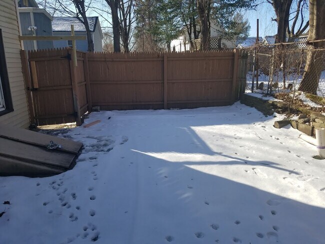 Private backyard in winter with private basement - 54 Lake Street