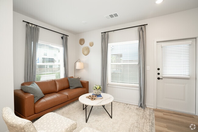 1BR, 2BA - 820SF - Living Room - Seagrass Cottages at Northshore