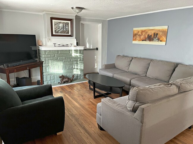Living room with hardwood floors and natural light - 2388 Young St SE