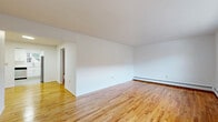 Located at 25 US-46 W in Lodi, NJ, this single-floor, one-bedroom, one-bathroom residence offers a well-organized layout across a comfortable living footprint. Warm-toned hardwood floors run throughout the main living areas, contributing to a bright and cohesive aesthetic.

The open living room is generously proportioned, featuring clean white walls, a baseboard heating system, and natural light from windows that overlook the surrounding neighborhood. It flows naturally into the dining area, creating a connected, functional living space. The front entry door opens directly into this area, providing a welcoming arrival.

The kitchen stands out with its modern renovation, showcasing crisp white shaker cabinetry, light countertops, stainless steel appliances including a gas range, built-in microwave, and dishwasher, as well as light hardwood-style flooring and a window above the sink.

The bedroom is a well-sized retreat with hardwood floors, a wall-mounted air conditioning unit, and multiple windows that allow for ample natural light and outdoor views. A large closet offers practical storage, complemented by three additional closets elsewhere in the unit.

The bathroom features a full tub and shower combination with white tile surround. A hallway connects the rooms efficiently, completing the practical and comfortable layout of this Lodi residence.