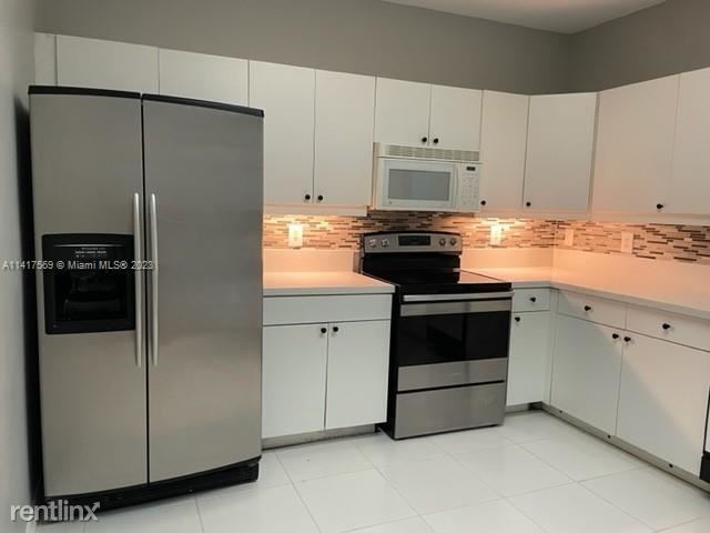 Building Photo - 3 br, 2.5 bath House - 9664 Royal Palm Blv...