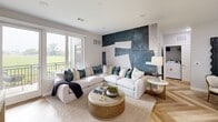 Located at 950 Trout Brook Drive in West Hartford, CT, this well-appointed two-bedroom, two-bathroom residence offers a thoughtfully designed single-floor layout with modern finishes throughout. The open-concept kitchen and living area serves as the heart of the home, anchored by a striking kitchen featuring white cabinetry with gold hardware, a herringbone-patterned light wood floor, stainless steel appliances, a marble-style tile backsplash, and a central island with a undermount sink and seating for two beneath elegant brass pendant lights. The living room extends naturally from the kitchen and is highlighted by a bold textured feature wall, recessed lighting, and sliding glass doors that open to a private balcony with open green views. The spacious primary bedroom offers generous proportions, recessed lighting, large windows framing outdoor scenery, and direct access to a well-designed en-suite bathroom with dual-sink slate-blue vanity cabinetry, gold accents, and a glass-enclosed shower. The second bedroom is cozy and well-lit, complete with a built-in closet. The second bathroom features large-format gray tile surround with a soaking tub-shower combo. Light wood flooring flows consistently throughout, lending warmth and continuity to the entire residence.