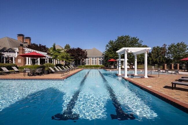 Swim a lap or lounge by our resort-style pool - The Estates at Horsepen