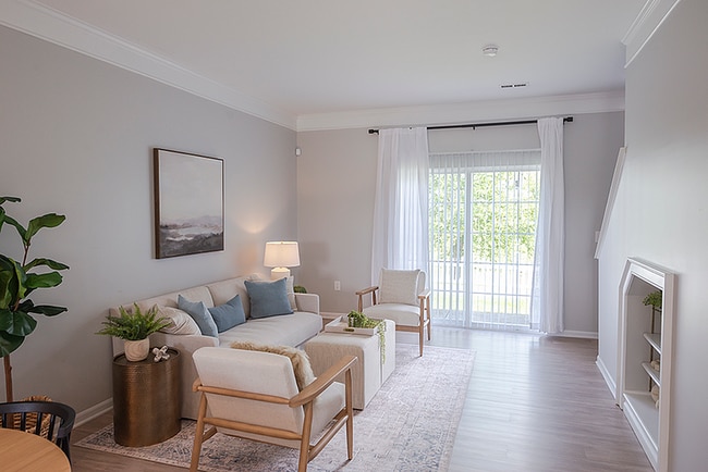 Living Room with Walk Out Patios - Troy Farms