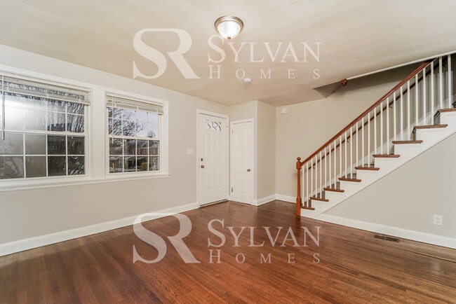 Building Photo - Welcome to this charming abode.