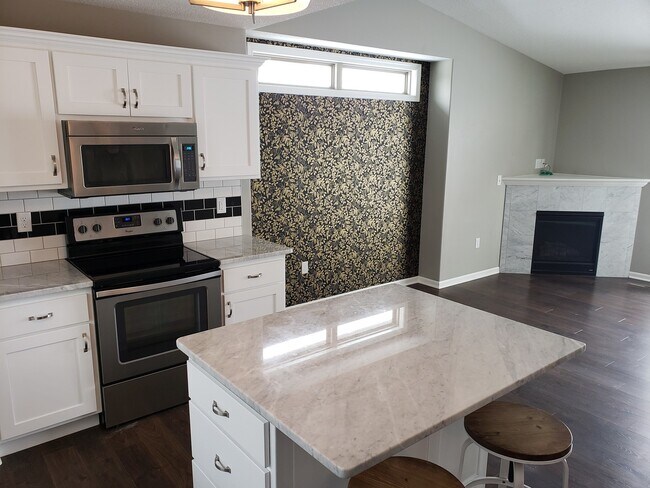 Building Photo - Cozy West Side Home + 2 Car Garage + Stain...