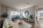 Located at 12430 Oxford Park Dr in Houston, TX, this 1-bedroom, 1-bathroom home offers a thoughtfully designed single-floor layout that maximizes functionality and comfort. The living room serves as the heart of the space, featuring hardwood-style flooring, neutral walls, and a sliding glass door that opens to a private balcony, filling the room with natural light and outdoor views. A dedicated dining area adjacent to the living space provides a comfortable setting for meals, with additional access to an in-unit laundry area nearby. The kitchen is outfitted with warm wood cabinetry, granite-style countertops, a double-basin sink, and black appliances including a range, microwave, dishwasher, and refrigerator — offering ample storage and prep space. The bedroom is a calm retreat, carpeted for comfort, with a ceiling fan, a large window overlooking lush greenery, and access to multiple closets for generous storage. A full bathroom and hallway connect the spaces efficiently. With three closets throughout and an entrance foyer, this home is designed to provide practical, organized living in a clean and modern aesthetic.