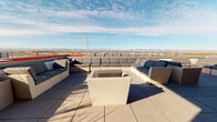 Located on W Tennessee Ave in Denver, CO, this rooftop terrace offers a striking outdoor experience defined by sweeping, unobstructed views of the Rocky Mountains and the Denver cityscape. The space is designed with a contemporary aesthetic, characterized by bold red and black architectural accents that frame the terrace and create a visually dynamic backdrop.

The open-air deck is finished with large-format concrete pavers throughout, lending a clean, modern feel underfoot. A generously sized lounge area anchors one section of the terrace, furnished with multiple wicker sectional sofas and accent chairs arranged to maximize the panoramic mountain views. Decorative planters with drought-tolerant landscaping line the perimeter walls, adding natural texture to the urban setting.

A covered bar station serves as a social hub, equipped with a wall-mounted television, a ceiling-mounted projector, and bar-height seating for several guests—ideal for gatherings and screenings. Floor-to-ceiling glass panels and white-framed double doors lead to an interior space, allowing natural light to flow while maintaining visual connection between indoor and outdoor areas. The rooftop receives abundant sunlight throughout the day, creating a bright and inviting atmosphere well-suited for both daytime and evening use.