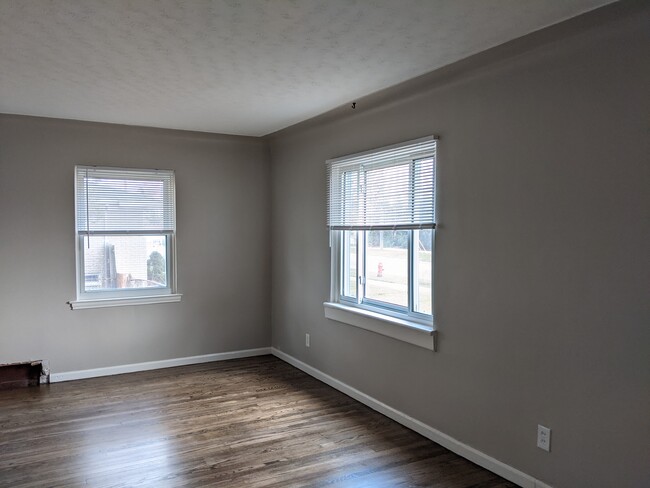 living room with refinished hardwood floors - 2071 Arcola St