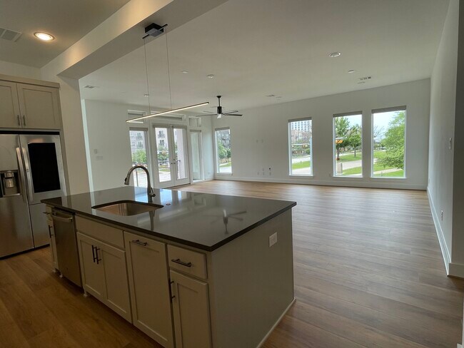 Sun-filled living, dining and kitchen - 7604 Highcroft Way