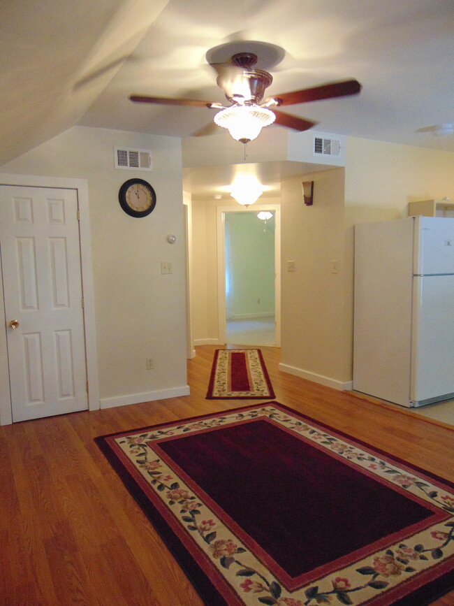 Living room towards hallway to bedrooms, bath, and laundry. - 61 West St