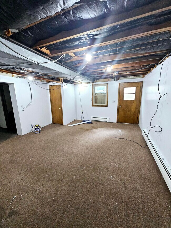 IN PROGRESS: Adding flat drywall ceiling to lift 1 ft higher and new carpet still. - 207 W Holly St