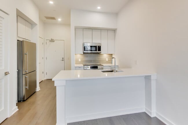 Building Photo - Top floor residence in elevator building with sweeping views.