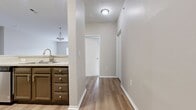This contemporary 1000 square foot apartment offers a thoughtfully designed living space with two bedrooms and one bathroom. The primary bedroom, spanning 210 square feet, provides a spacious retreat. The open-concept layout seamlessly integrates the kitchen and living area, creating a fluid and functional space.

The kitchen is a highlight, featuring modern cabinetry, stainless steel appliances, and ample counter space with a sleek design. The bathroom showcases a clean, updated look with a combination tub and shower. 

Throughout the apartment, neutral tones and an abundance of natural light create a bright, airy ambiance. Large windows in the bedrooms and living area offer pleasant views and illuminate the space. The flooring varies between plush carpeting in the bedrooms and stylish wood-look flooring in the main living areas, adding warmth and texture.

Storage is well-considered, with built-in closets in the bedrooms and additional cabinet space in the kitchen. The overall design emphasizes clean lines and a minimalist aesthetic, making it an ideal canvas for personal style while maintaining a modern, functional living environment.

Located at 6300 Refugee Rd, this single-story apartment combines comfort and contemporary design, offering a turnkey living solution in a convenient setting.