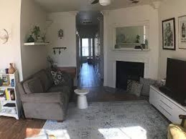 living room with view of hallway - 402 W 44th St