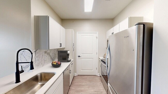 Newly Renovated Kitchen with Stainless Steel Appliances - Double Creek Flats Apartments