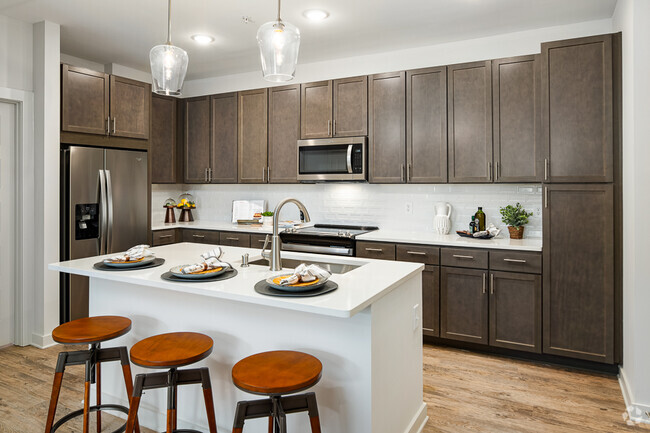 Model Kitchen with Espresso Cabinetry and Stainless Steel Appliances - Bexley Parkstone