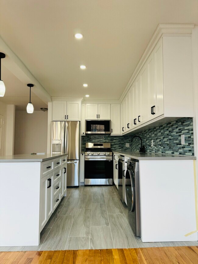 Kitchen with W/D - 12208 26th Ave