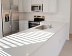 This 1160 square foot single-story residence in San Antonio, TX offers a well-designed layout with 4 bedrooms and 2 bathrooms. The home features a modern, open-concept kitchen and living area, ideal for both daily life and entertaining. The kitchen is equipped with stainless steel appliances, white cabinetry, and a convenient island with a sink.

The primary bedroom, measuring 170 square feet, provides a generous space for relaxation. All bedrooms feature neutral carpeting and ample natural light through large windows. The bathrooms are designed with clean, white fixtures and tiled surroundings, offering a fresh and modern aesthetic.

The home includes a garage with a textured concrete floor and an automatic door opener, providing secure parking and additional storage space. Throughout the house, recessed lighting and smooth ceilings contribute to a contemporary ambiance. The property also features a backyard area, perfect for outdoor activities or future landscaping projects.

With its neutral color palette, modern amenities, and thoughtful layout, this home presents an ideal canvas for personalization and comfortable living in a desirable San Antonio neighborhood.