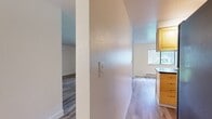 This 860 square foot apartment in Tualatin, Oregon offers a thoughtfully designed living space with two bedrooms and two bathrooms. The single-story layout maximizes functionality, featuring an open-concept design that seamlessly integrates the living room and kitchen areas. The kitchen boasts light wood cabinetry, dark countertops, and modern appliances, creating a pleasant cooking environment with ample storage.

Both bedrooms are generously sized, with the primary bedroom measuring 160 square feet. Each room features hardwood flooring, large windows for natural light, and convenient closet space. The two bathrooms are well-appointed, with one showcasing vibrant yellow cabinetry that adds a pop of color to the otherwise neutral palette.

Throughout the apartment, the hardwood flooring creates a cohesive and contemporary feel. The space is characterized by clean lines, white walls, and modern lighting fixtures, contributing to a bright and airy atmosphere. Built-in heating elements ensure comfort year-round.

This apartment offers a perfect blend of style and practicality, ideal for those seeking a modern living space in a suburban setting. Its efficient layout and updated features make it well-suited for individuals or small families looking for a comfortable and low-maintenance home.