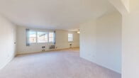 Located at 1641 33rd Street Southwest in Allentown, PA, this single-floor, 2-bedroom, 2-bathroom residence offers a practical and comfortable layout. The open living and dining areas are generously sized, featuring neutral carpet flooring, soft cream-toned walls, and multiple windows that invite abundant natural light and views of the surrounding neighborhood. Ceiling fans in the living area and bedrooms provide year-round comfort. The kitchen stands out with rich cherry wood cabinetry, granite countertops, tile flooring, and white appliances including a gas range, built-in microwave, dishwasher, and refrigerator. The primary bedroom is a well-proportioned retreat with dual closets, windows on two walls, a ceiling fan, and a wall-mounted HVAC unit. The second bedroom also features carpeted floors, a window with outdoor views, and its own wall unit for climate control. Both bathrooms include tiled tub-shower combinations. Additional highlights include four closets offering generous storage, an in-unit laundry room, and two hallways that connect the spaces efficiently. The exterior features a brick façade with a landscaped lawn and dedicated parking, completing this well-organized and functional residence.