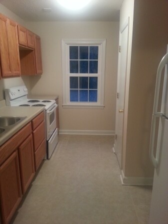 New cabinetry and tile floors - Cooper Place