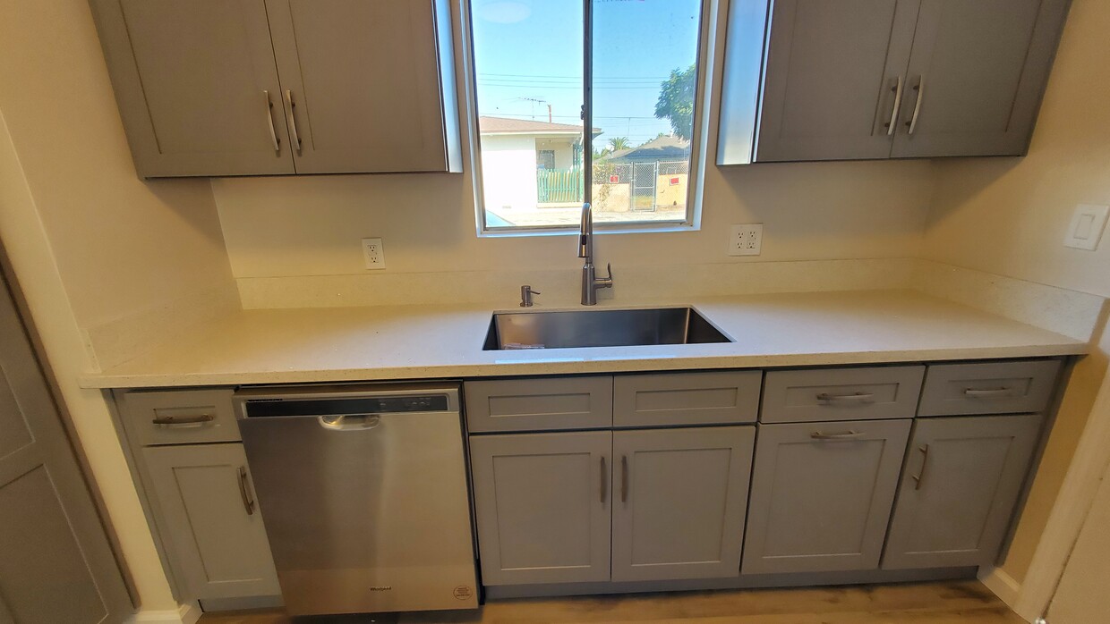 Completely updated kitchen with new cabinets, new Quartz counters, new single-bowl undermounted sink - 24658 Eshelman Ave