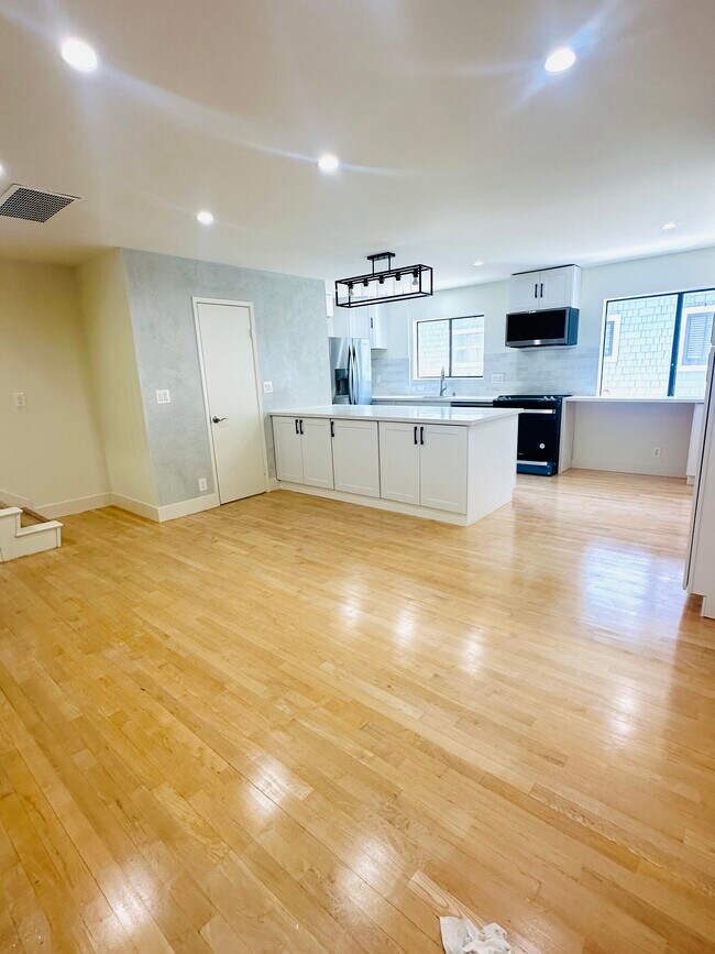 Open floor plan: Kitchen and dining room view and powder bathroom - 3812 Vía Dolce