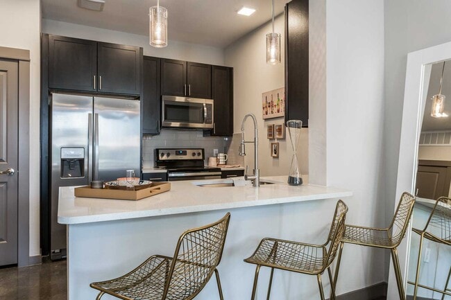 Building Photo - Your Downtown Lifestyle Begins Now