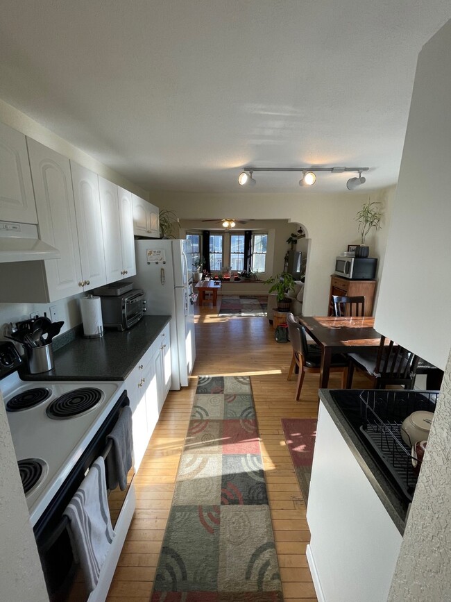 View from Kitchen to large front windows - 721 Oneida St