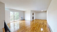 Located at 33 Wedgewood Dr in Carteret, NJ, this 2-bedroom, 1-bathroom residence offers a thoughtfully laid-out single-floor plan highlighted by polished hardwood floors throughout. The spacious living room is a standout feature, bathed in natural light through large sliding glass doors that open onto a private balcony with lush tree views, creating a bright and airy atmosphere. A wall-unit air conditioner and baseboard heating ensure year-round comfort.

The kitchen is well-equipped with rich dark wood cabinetry, granite countertops, stainless steel refrigerator, and a stainless steel dishwasher, complemented by a window that brings in additional natural light. The bathroom features a tub and shower combination with a glass sliding door enclosure and clean white tile surround.

Both bedrooms are generously proportioned, each featuring gleaming hardwood floors, natural window light, baseboard heating, and sliding-door closets offering ample storage. The spacious primary bedroom provides a comfortable retreat with room for full furnishings. Clean white walls and consistent hardwood flooring throughout create a cohesive and inviting aesthetic across the entire residence.