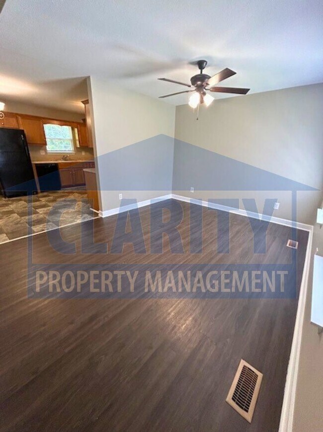 Building Photo - Charming three-bedroom home with carport!