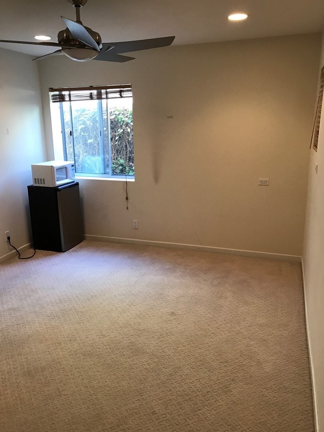 Bedroom with fridge & microwave. - 133 43rd St