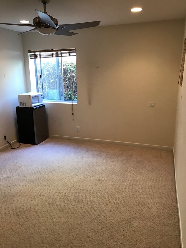 Bedroom with fridge & microwave. - 133 43rd St