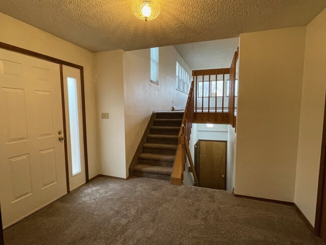 Entryway and stairs from Garage to Upper Floor - 21 El Sereno Dr