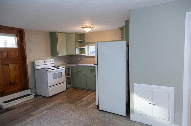Kitchen with second entrance door - 63C Brewster Ave