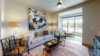 Located at 5745 Golden Triangle Blvd in Fort Worth, Texas, this single-story residence offers a well-designed layout that balances modern aesthetics with functional living spaces. The open-concept floor plan connects the kitchen, dining, and living areas seamlessly, creating an inviting flow throughout the home.

The kitchen is a standout feature, showcasing a two-tone cabinetry design that pairs light wood upper cabinets with darker lower cabinets. Granite countertops extend to a generous island, complemented by a glass tile backsplash and stainless steel appliances, including a French door refrigerator, built-in microwave, and range. Wood-look flooring anchors the space with warmth.

The living area provides a comfortable retreat, featuring a ceiling fan, large sliding glass door that draws in natural light and outdoor views, and ample room for relaxed seating arrangements.

The bedrooms are carpeted for comfort and equipped with ceiling fans and roller shade windows that allow soft, diffused natural light. Each room offers a calm, restful atmosphere suited for relaxation.

The bathroom features wood-look flooring, a glass-enclosed shower, granite vanity countertop with dark cabinetry, and clean, neutral wall tones that contribute to a polished, contemporary finish throughout.