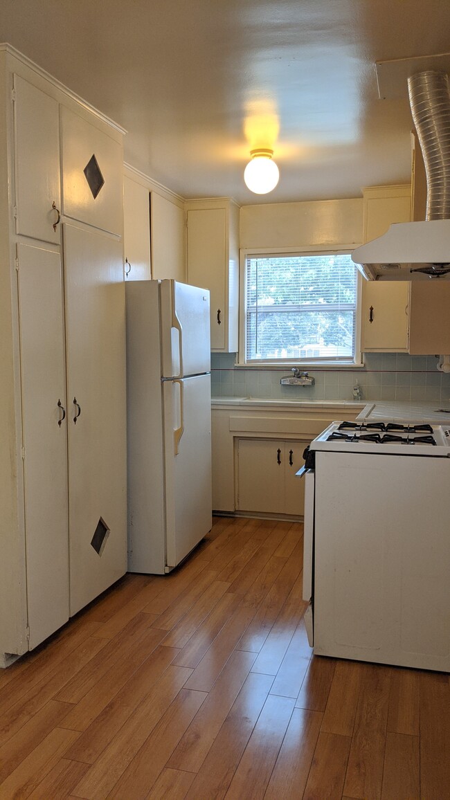 Kitchen with refrigerator - 129 Genoa St