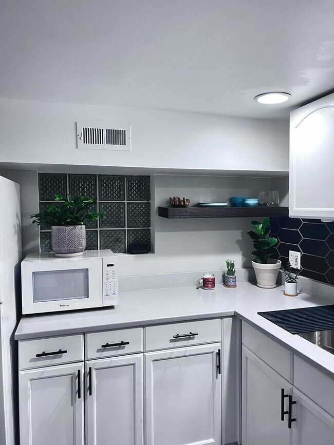 Kitchen. Wood shelf is perfect for displaying kitchenware. - 2134 N Maplewood Ave