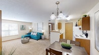 Located at 5160 Preferred Pl in Hilliard, Ohio, this single-floor, 3-bedroom, 2-bathroom home offers a practical and comfortable layout. The open-concept living and dining area forms the heart of the space, where a carpeted living room flows naturally into the dining area, both illuminated by a stylish multi-arm chandelier overhead. Natural light enters through sizable windows with horizontal blinds, enhancing the warm, neutral color palette throughout.

The galley-style kitchen features warm oak cabinetry extending to the upper walls, white appliances including a refrigerator, electric range, and dishwasher, as well as a double basin sink and ample counter space — all efficiently arranged for everyday use.

The primary bedroom is generously sized, offering carpet flooring, a large window for natural light, and a closet with an oak-panel door. The two additional bedrooms share a similar design, each with carpet flooring and closet access. Two bathrooms serve the home: one features a shower stall and vanity with oak cabinetry, while the other includes a tub-shower combination, vanity, and a medicine cabinet. A connecting hallway ties all rooms together in a logical and accessible floor plan.