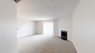 Located at 243 W 80th Ave in Denver, CO, this single-floor, one-bedroom, one-bathroom home offers a well-organized layout across a comfortable and efficiently utilized floor plan. The living room serves as the focal point of the home, featuring plush carpeting, a textured ceiling, and a fireplace flanked by a large sliding glass door dressed with vertical blinds that floods the space with natural light. A distinctive exposed wood beam accents the transition area between the living room and kitchen, adding a touch of architectural character. The kitchen is outfitted with crisp white cabinetry, light countertops, a built-in range, and wood-look flooring that extends through the functional areas of the home. A dedicated laundry area with stacked units is conveniently accessible from the hallway. The bedroom offers comfortable proportions, carpeted flooring, a ceiling fan, a closet with louvered doors, and direct access to an additional walk-in closet and the bathroom. The bathroom features a full soaking tub, wood-look vinyl flooring, and clean white finishes. Two closets provide ample storage throughout. This home presents a neutral, move-in-ready aesthetic well-suited for comfortable everyday living.