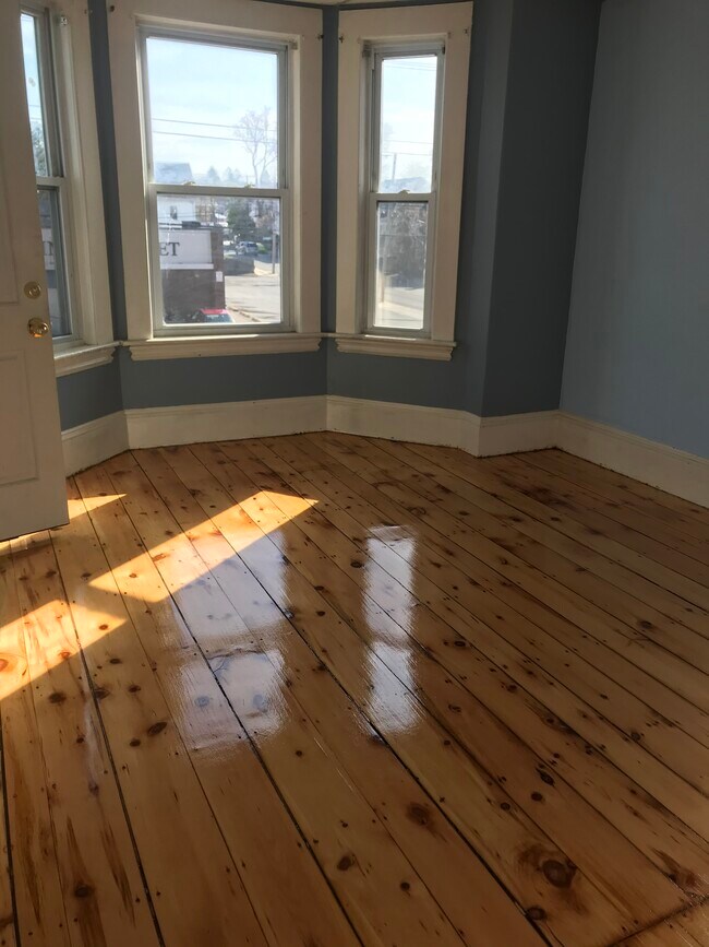 Wide pine floors refinished - 258 Eastern Ave